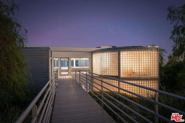 view of back house at dusk