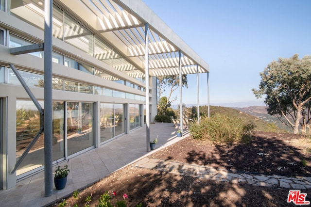 view of yard with a patio and a mountain view