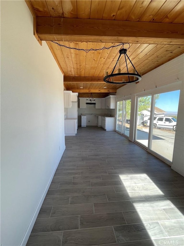 hall with beam ceiling and wooden ceiling