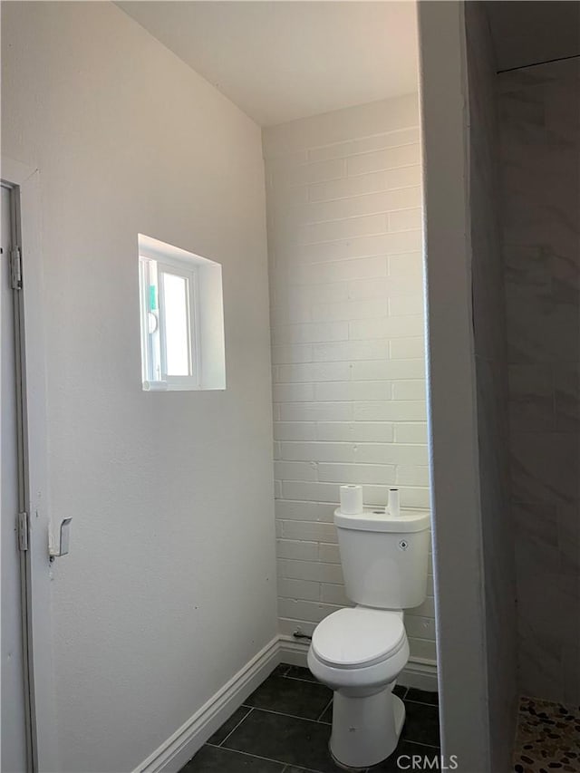 bathroom featuring tile patterned flooring and toilet