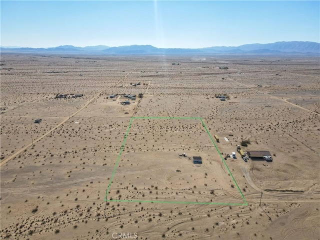 birds eye view of property featuring a mountain view