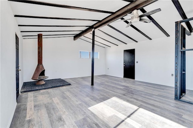 basement with ceiling fan and hardwood / wood-style flooring