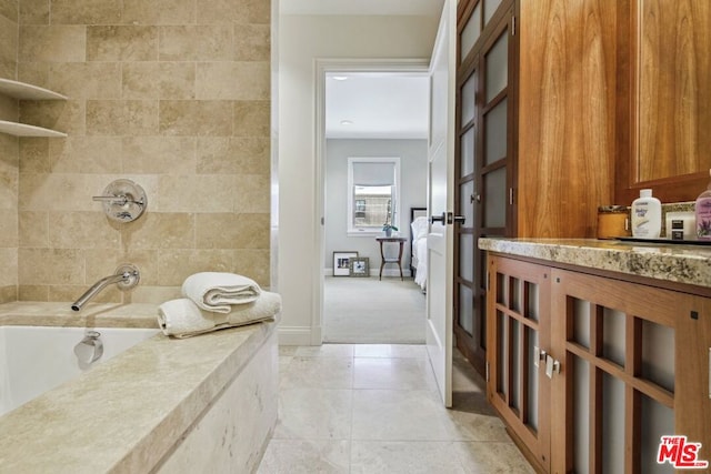 bathroom featuring tile patterned flooring and shower with separate bathtub