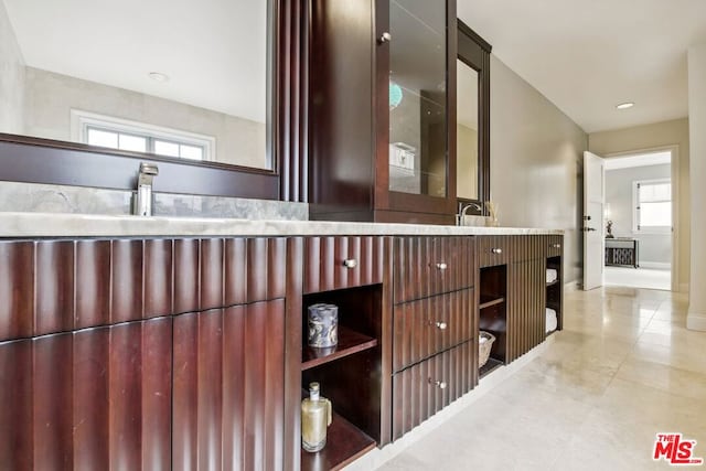 bathroom with plenty of natural light and vanity