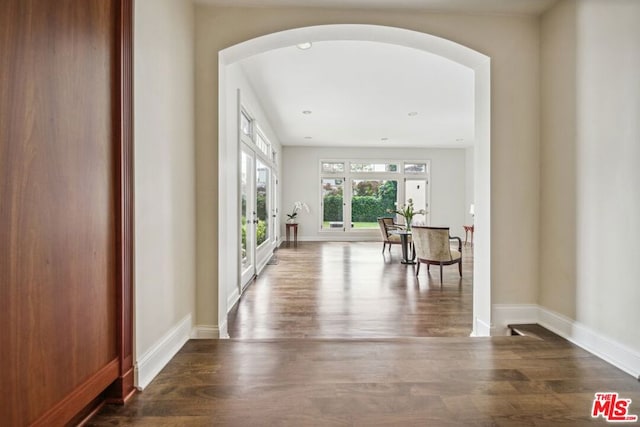 corridor featuring french doors and wood-type flooring