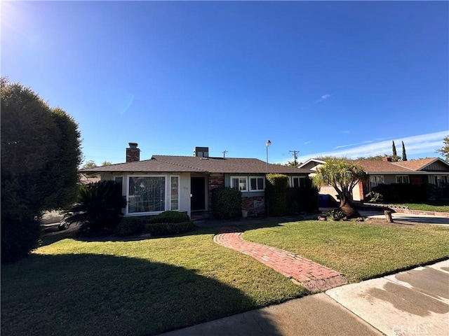 single story home with a front yard