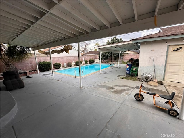 view of pool featuring a patio area, a fenced backyard, and a fenced in pool