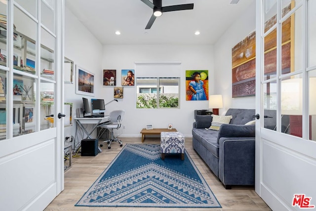 office area with french doors, ceiling fan, and light hardwood / wood-style floors