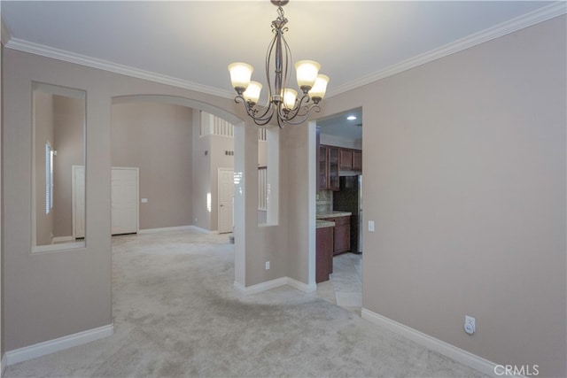 unfurnished dining area with light carpet, crown molding, and a chandelier