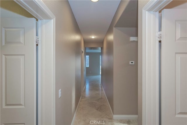 corridor with light tile patterned floors