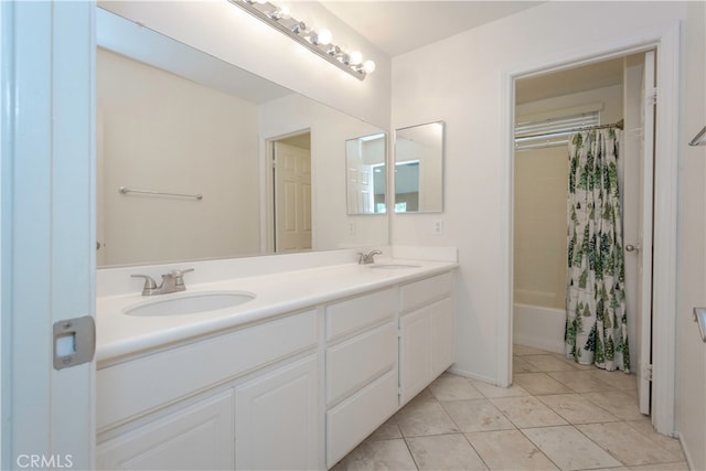 bathroom with vanity, tile patterned floors, and shower / tub combo