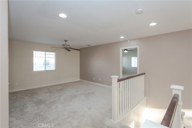 carpeted empty room with ceiling fan