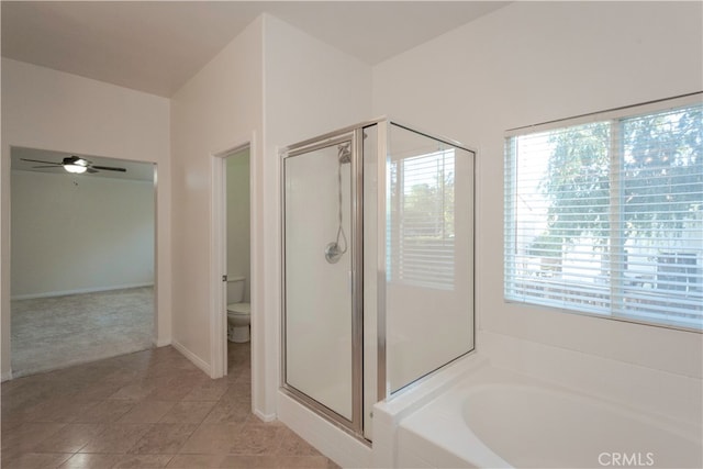 bathroom with tile patterned flooring, toilet, shower with separate bathtub, and ceiling fan