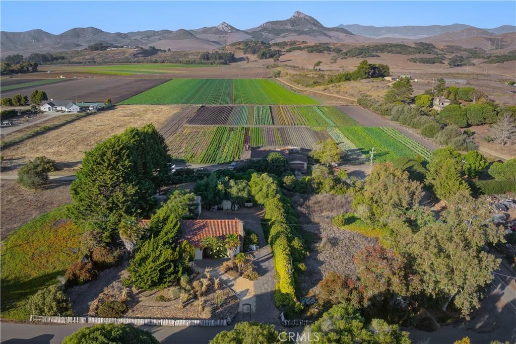 aerial view featuring a mountain view and a rural view