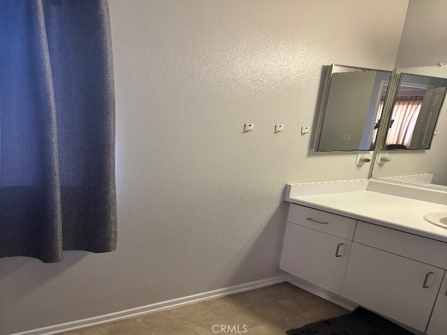 bathroom featuring vanity and tile patterned flooring