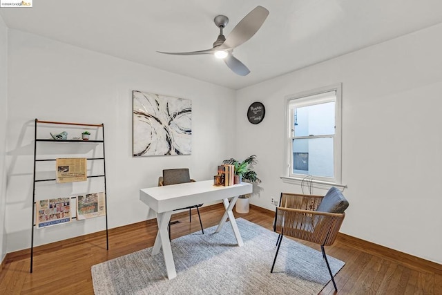 home office featuring hardwood / wood-style floors and ceiling fan