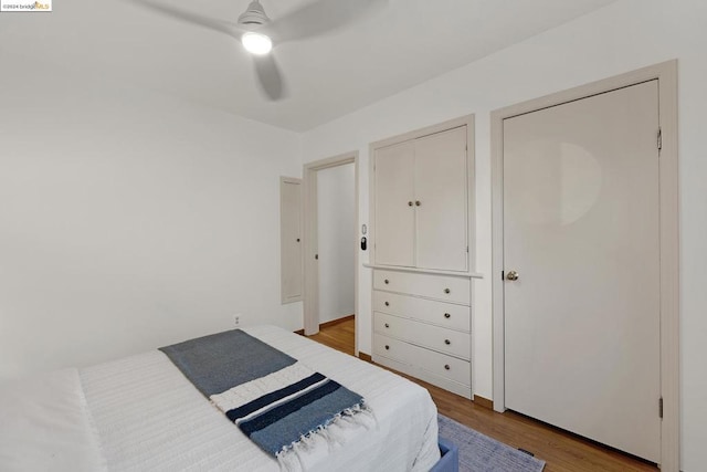 bedroom with ceiling fan and light hardwood / wood-style floors