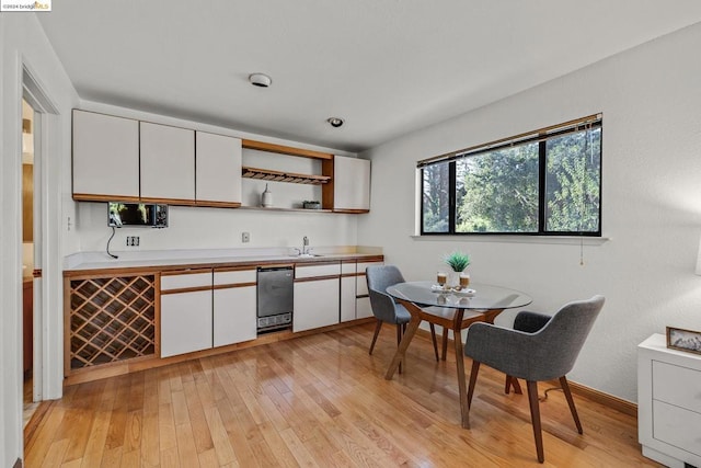 kitchen featuring light hardwood / wood-style flooring and white cabinetry