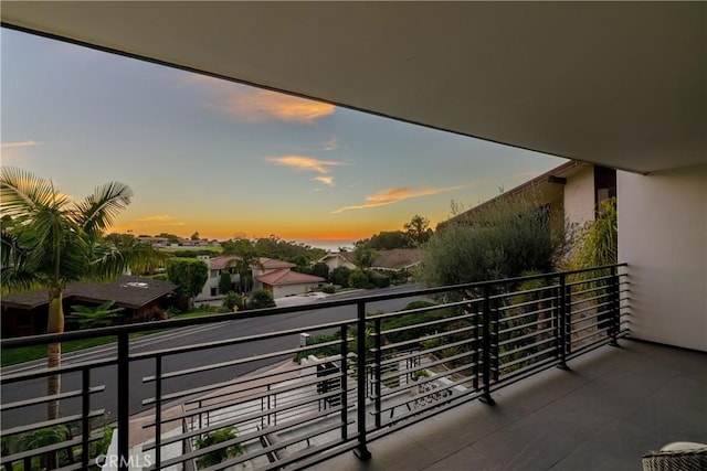 view of balcony at dusk