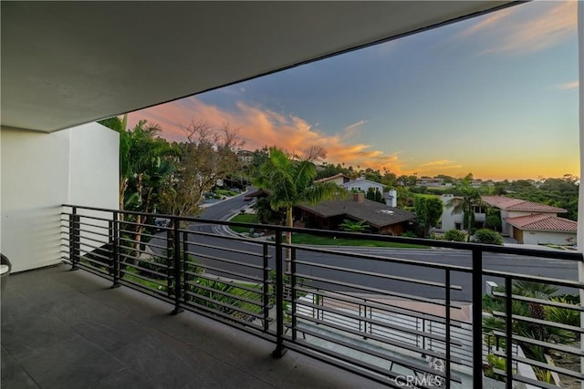 view of balcony at dusk