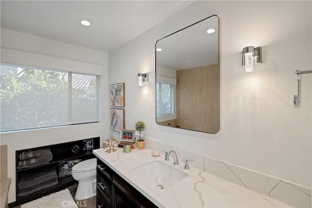 bathroom with vanity and toilet