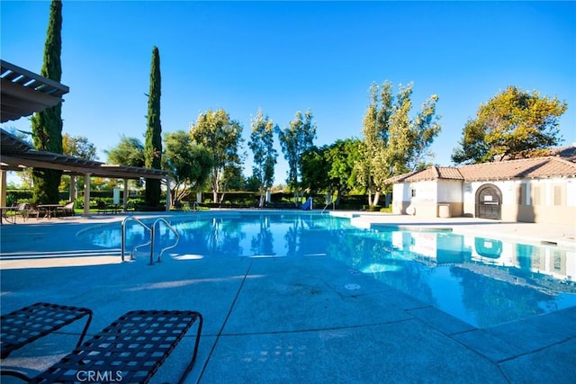 view of pool featuring a patio area and a pergola