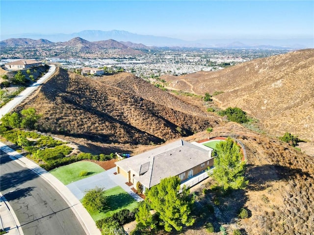 birds eye view of property with a mountain view