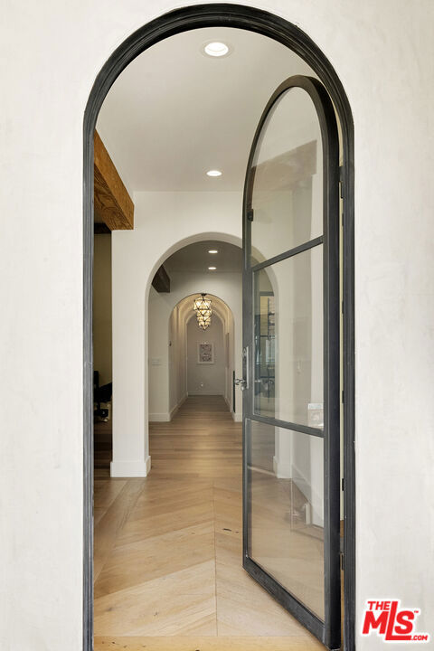 corridor with light parquet flooring