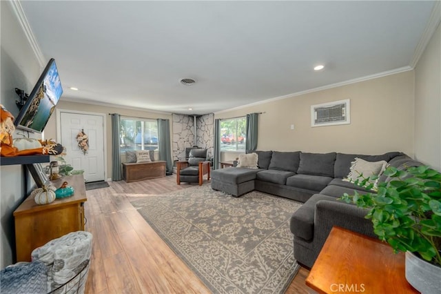 living room featuring crown molding and hardwood / wood-style floors