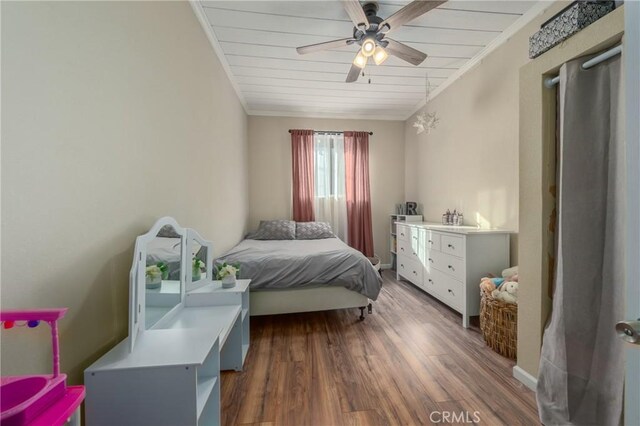 bedroom with ceiling fan, wood ceiling, and dark hardwood / wood-style floors