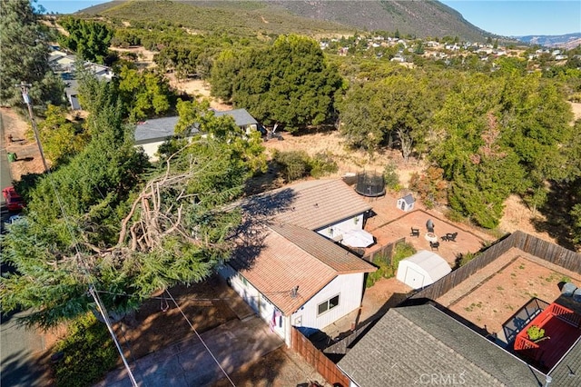 birds eye view of property with a mountain view