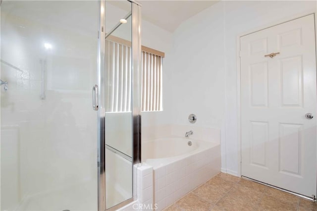 bathroom featuring separate shower and tub and tile patterned flooring