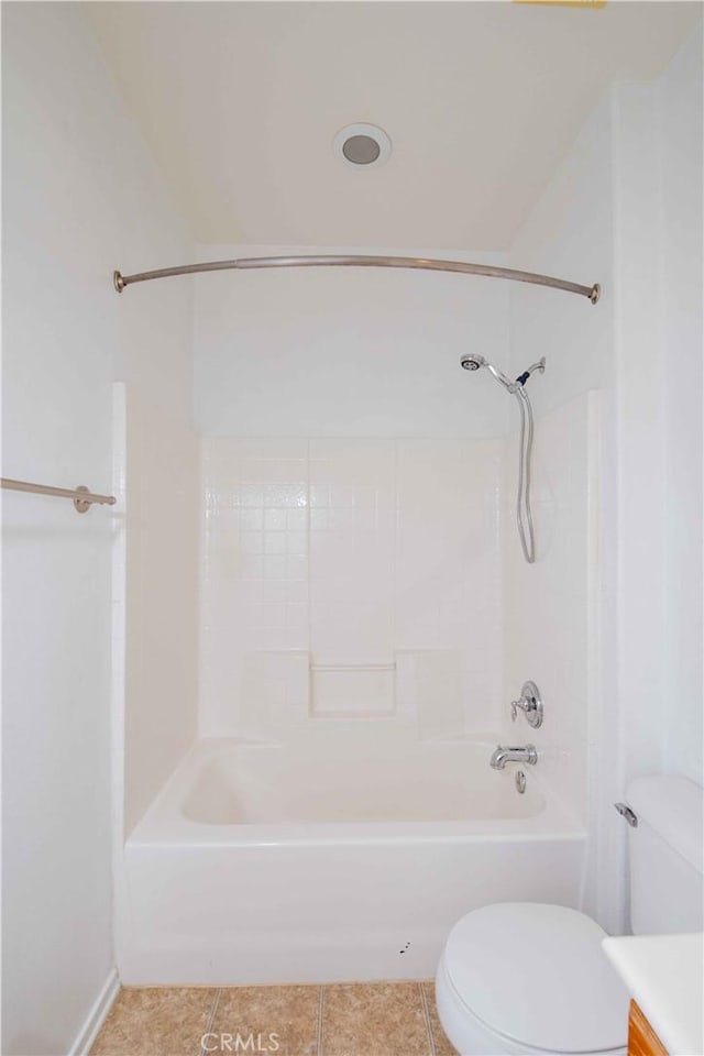 full bathroom with tile patterned floors, vanity, tub / shower combination, and toilet