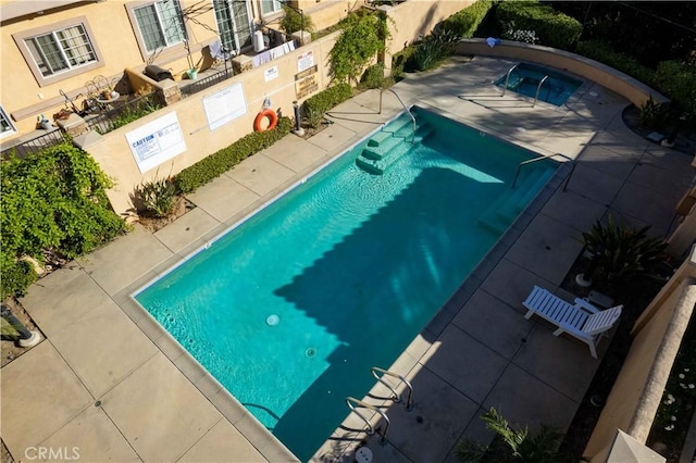 view of pool featuring a patio