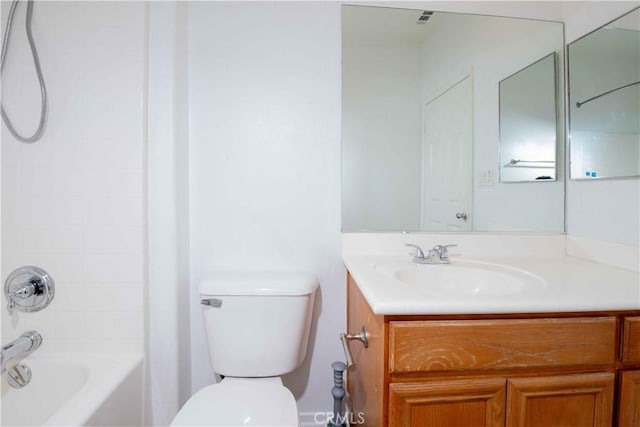 full bathroom with bathtub / shower combination, vanity, and toilet