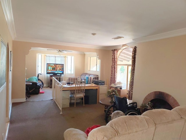 carpeted living room featuring ceiling fan and crown molding