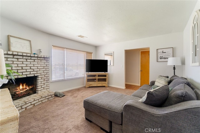 living room with carpet, a textured ceiling, and a fireplace