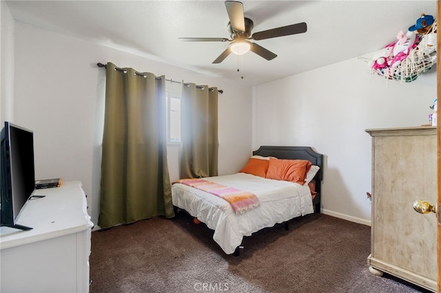 bedroom featuring ceiling fan and dark colored carpet