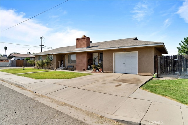 single story home with a front yard and a garage