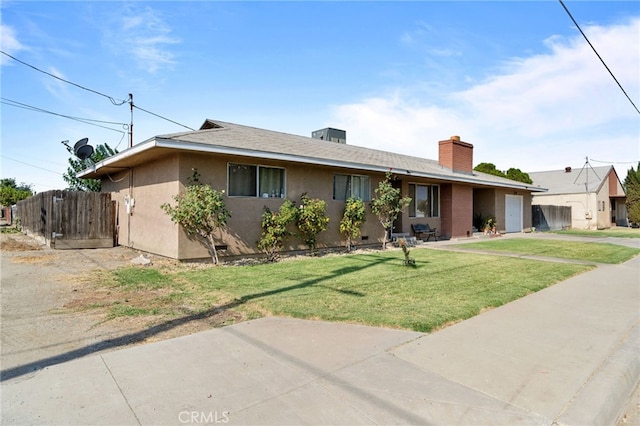 ranch-style house featuring a front yard