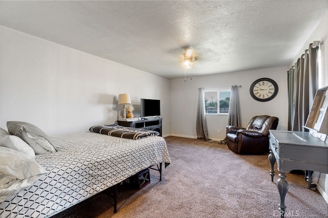 bedroom with carpet, a textured ceiling, and ceiling fan