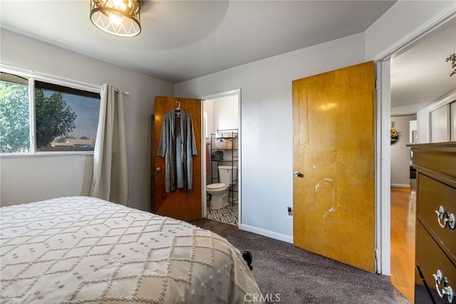 carpeted bedroom with ensuite bath