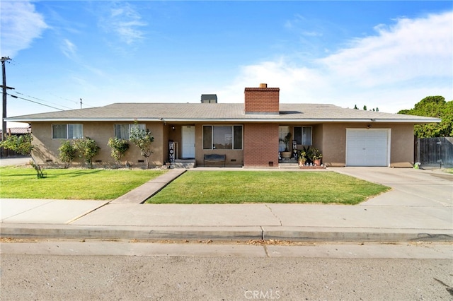 single story home with a front yard and a garage