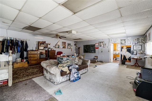 carpeted living room featuring a paneled ceiling and ceiling fan