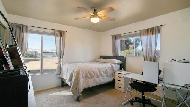 bedroom featuring ceiling fan and light colored carpet