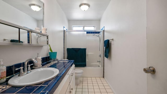 full bathroom with tile patterned flooring, vanity, toilet, and bath / shower combo with glass door