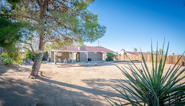 back of property with a patio area