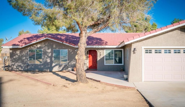 ranch-style house featuring a garage