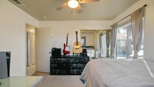 bedroom featuring light carpet, a closet, access to outside, and ceiling fan