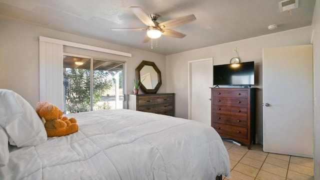 bedroom featuring access to exterior, ceiling fan, and light tile patterned floors